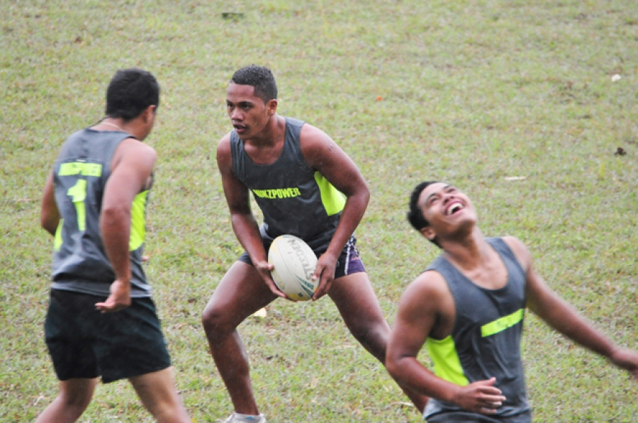 Touch rugby continues in wet, windy weather