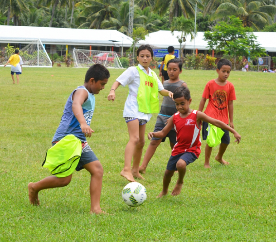 Young pupils learn new soccer skills